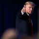 Former U.S. President Donald Trump give a thumbs up as he walks off after speaking at the Conservative Political Action Conference (CPAC) in Dallas, Texas on July 11, 2021.